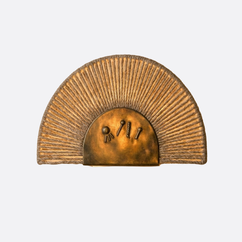 Sun-inspired bronze wall lamp with ropes